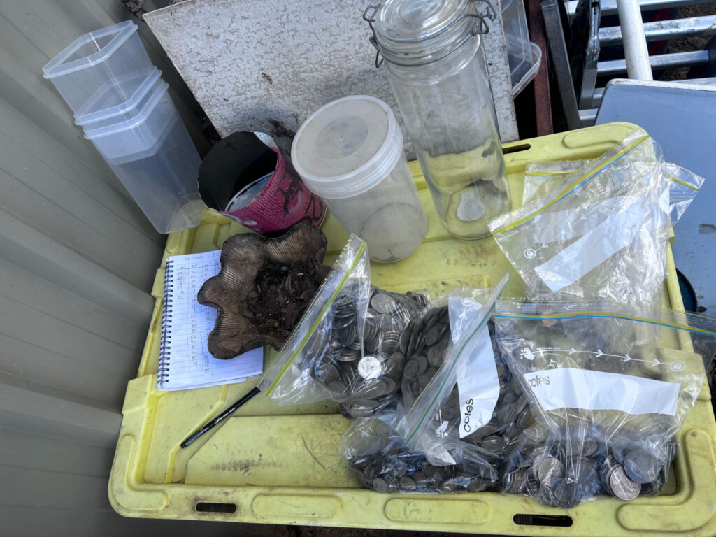 Australian coins being sorted by denomination tallied and bagged